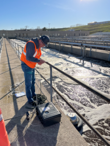 A WEA odor control engineer collecting samples